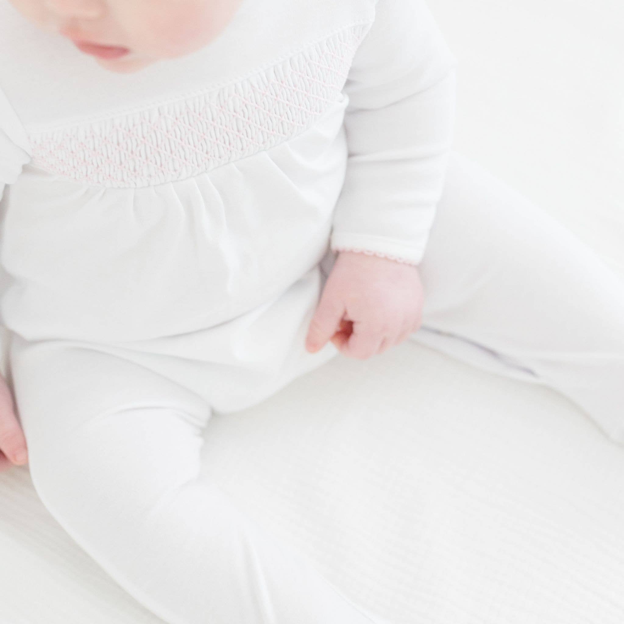 Essentials White with Pink Trim Smocked Footie - Gabrielle's Biloxi