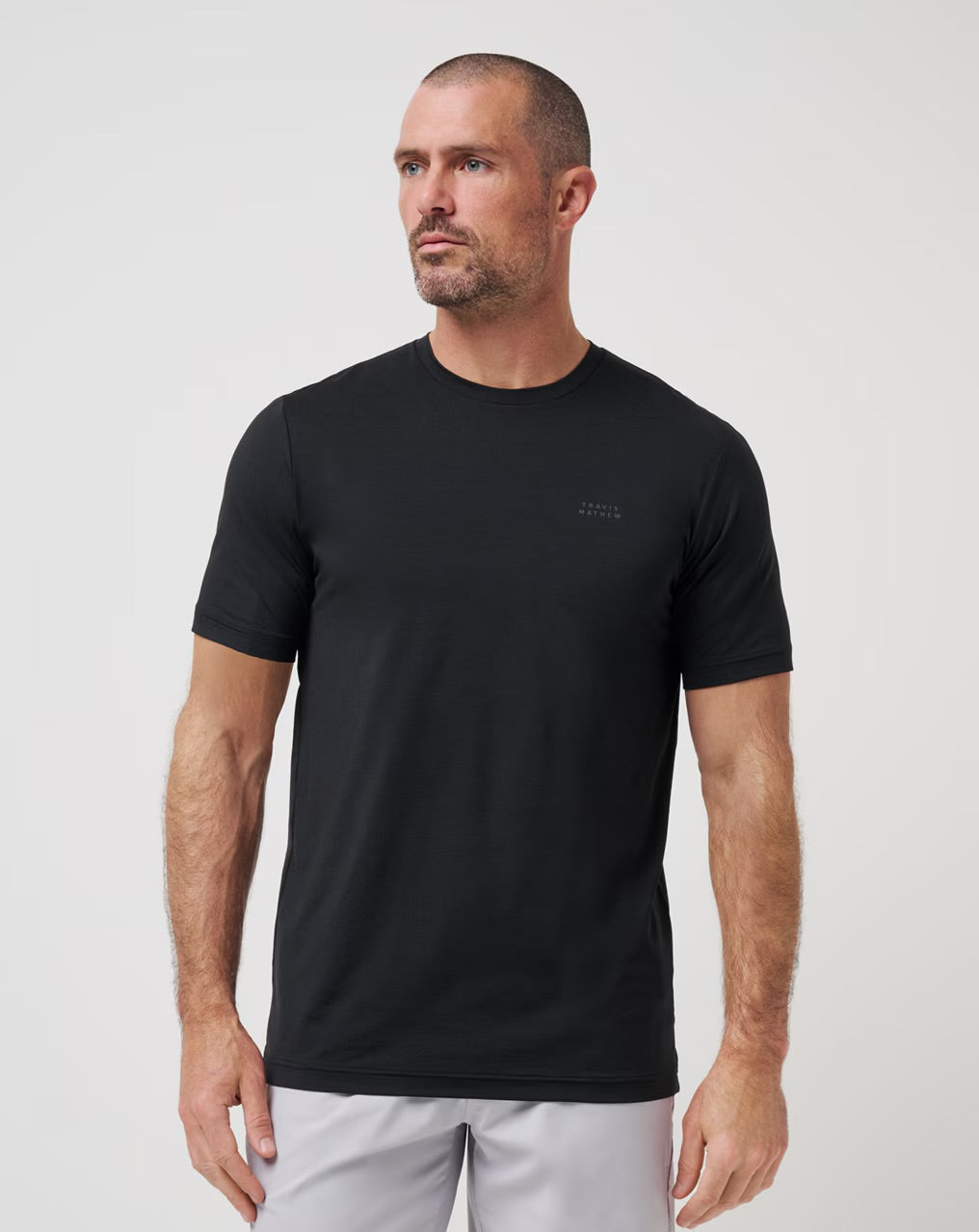 Travis Mathew Heater Pro Tee - Black - Gabrielle's Biloxi
