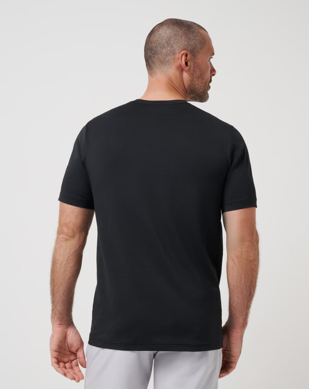 Travis Mathew Heater Pro Tee - Black - Gabrielle's Biloxi
