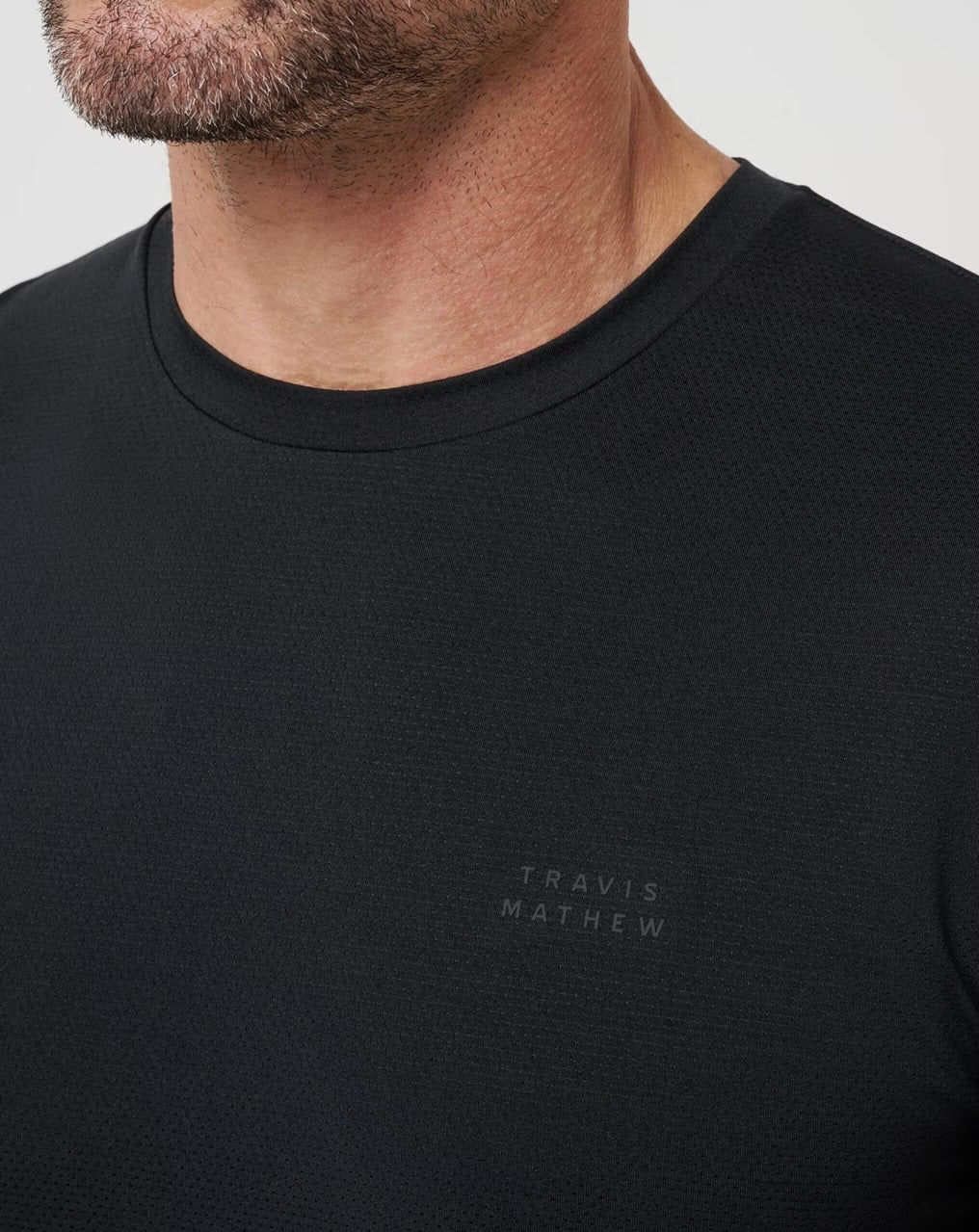 Travis Mathew Heater Pro Tee - Black - Gabrielle's Biloxi