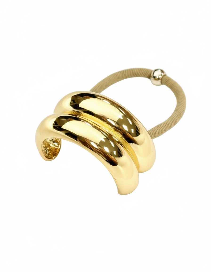 Gold hair tie on white background