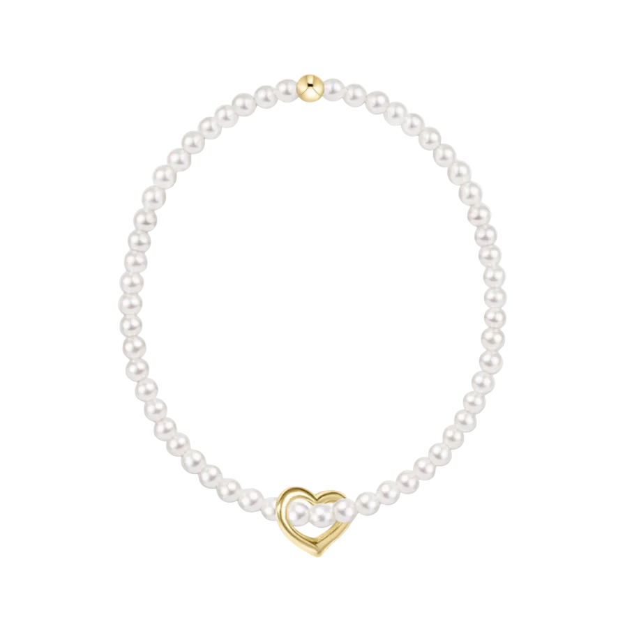 Pearl necklace with a gold heart-shaped clasp on a white background