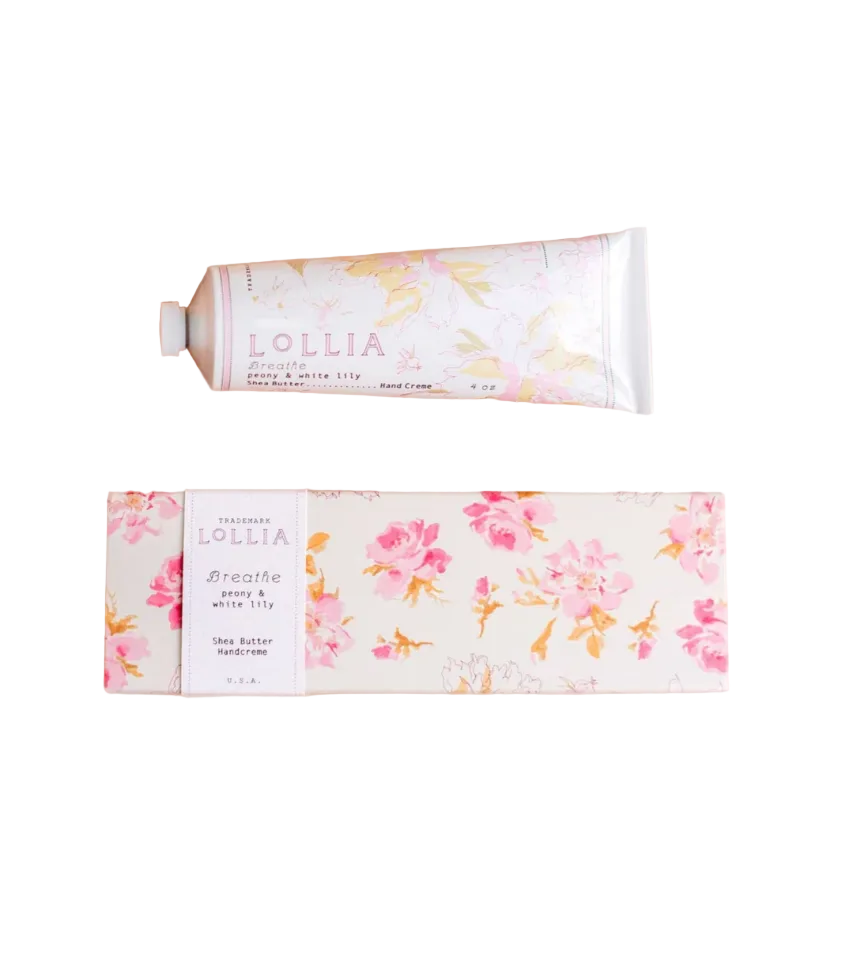 Lollia hand cream with floral packaging on a beige background